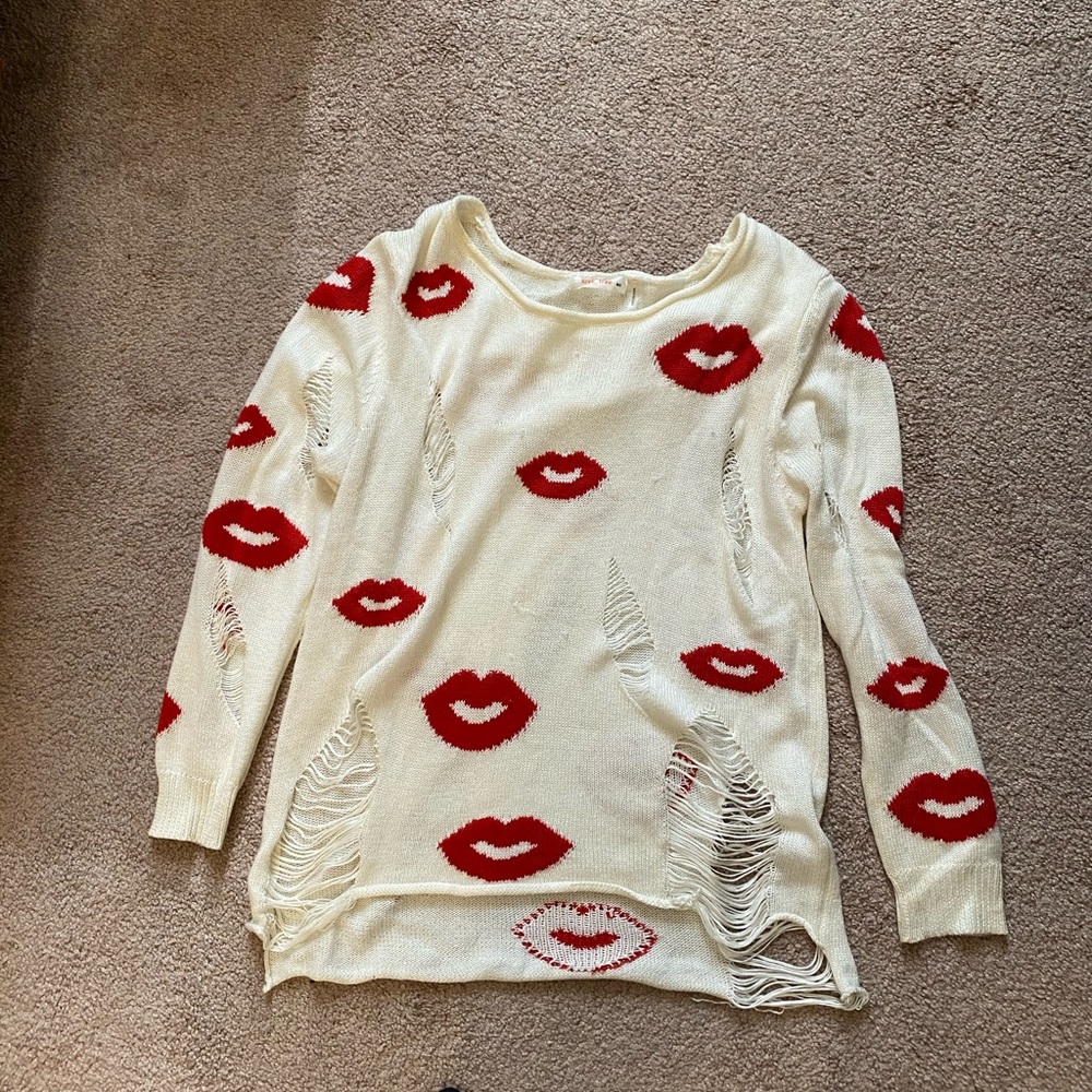 Distressed lip print sweater